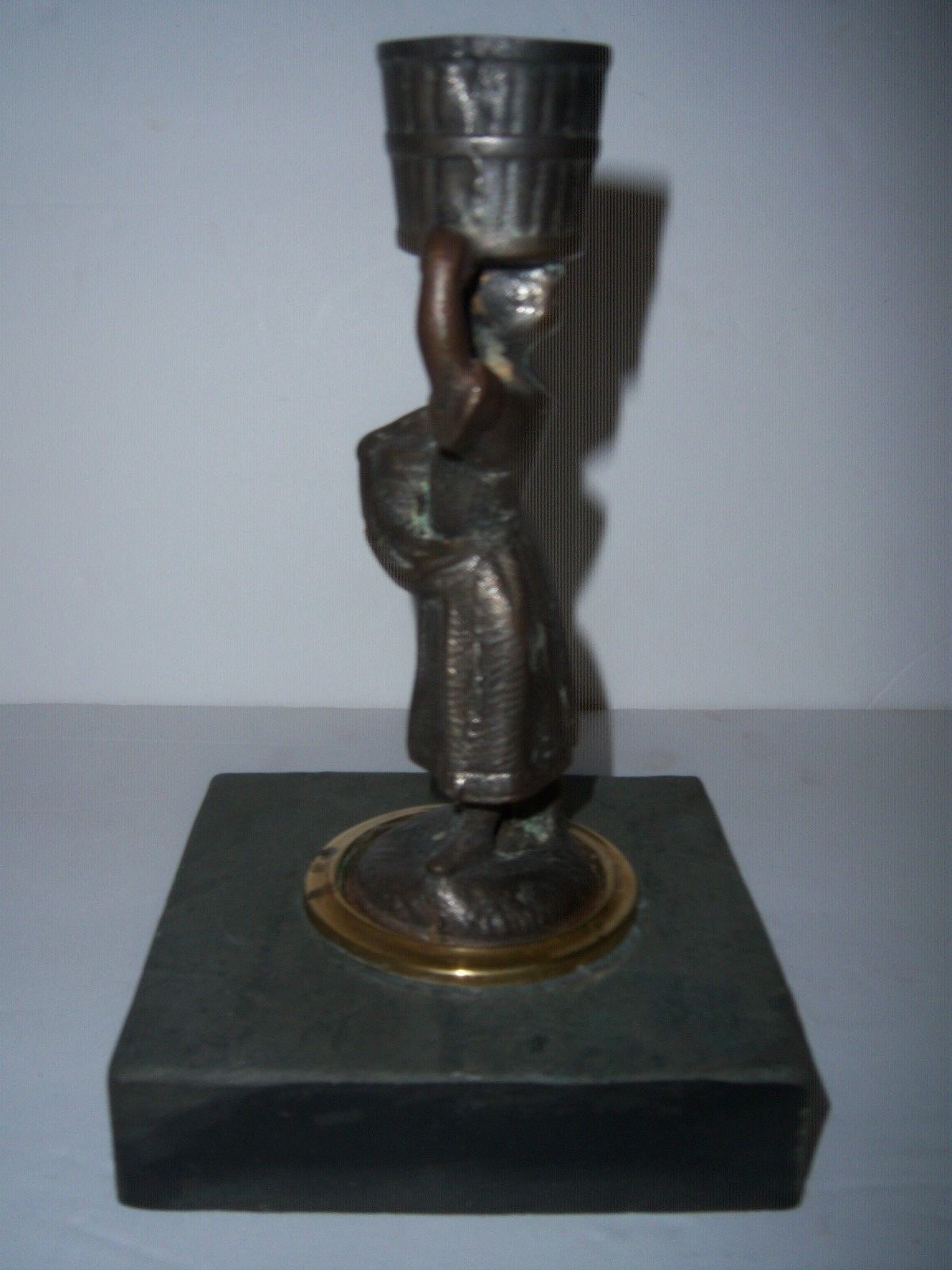 ..ANTIQUE CAST IRON WOMAN CANDLE HOLD ON MARBLE