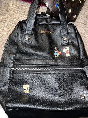 Disney: Disney park pin design black faux leather Mickey Mouse backpack.