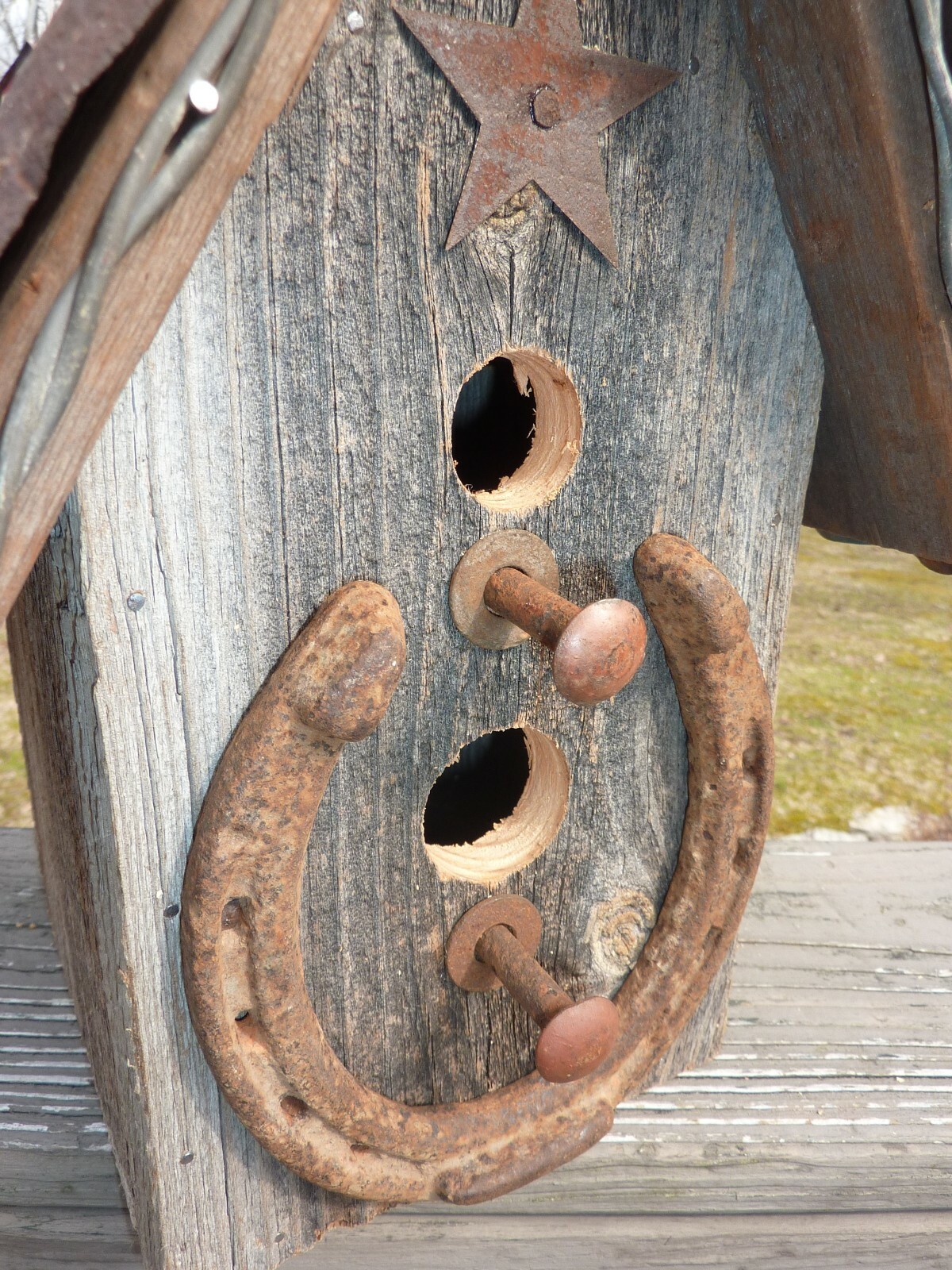 Handmade Rustic Bird House made from old barn wood with tin roof and barbed wire