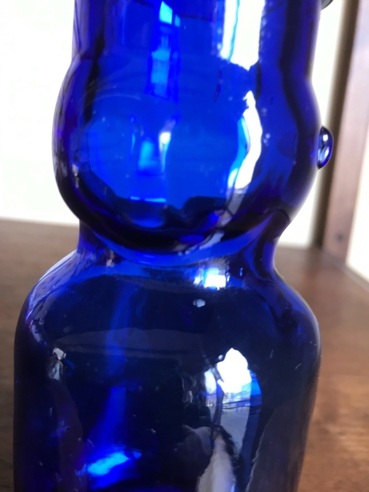 Vintage  BABY FACE HALF PINT MILK BOTTLE. Blue glass