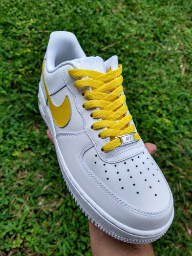 white air force ones with yellow swoosh
