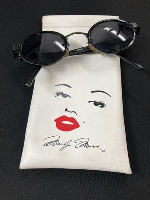 Marilyn Monroe sun glasses with case. they are pre-owned have wear. black rim