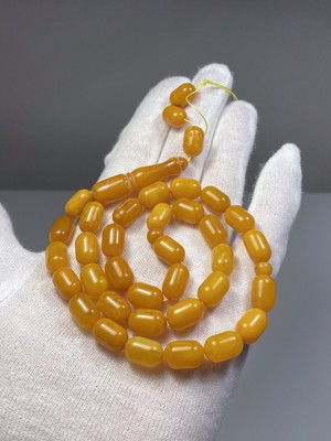 cognac cabochons Matt cabochons The bracelet is multicolored from natural Baltic amber Made of hard amber plates. white cabochons
