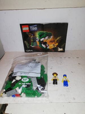 LEGO STUDIOS 1354 DINO HEAD  COMPLET  NOTICE ET MINIFIG