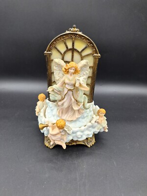 AVON LIGHTED MUSIC CAROUSEL OF CHERUBS ROTATE AROUND ANGEL HARK THE HERALD...
