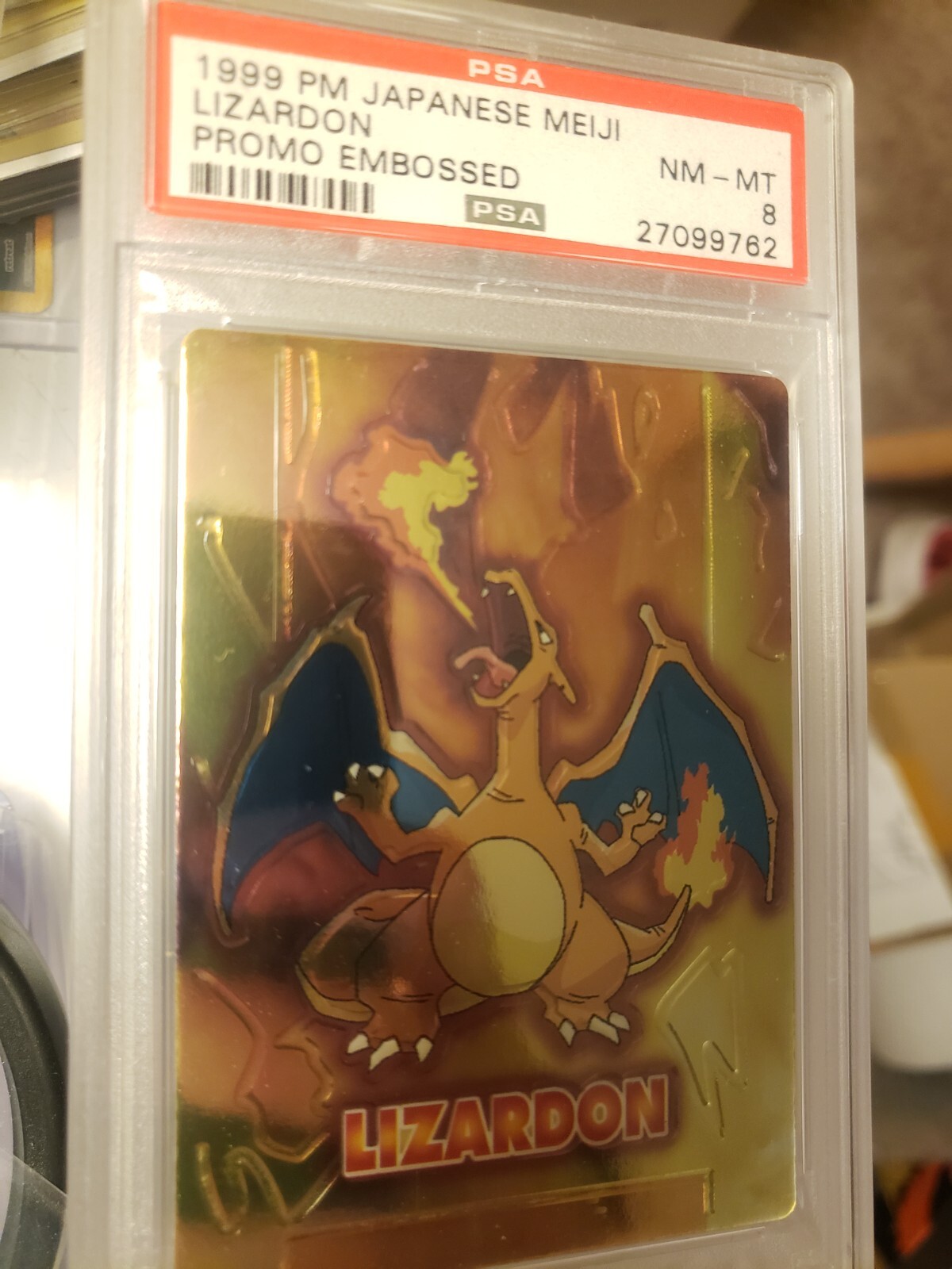 PSA 8 Charizard Meiji Embossed Lizardon 1999 Japanese promo