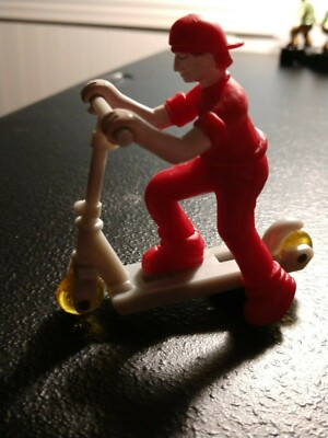 ARTIN skate board figure. measured at 2 & 3/4 inch tall, read please 