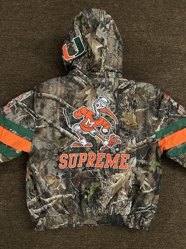 SUPREME SUPREME MITCHELL & NESS NCAA HOODED STADIUM JACKET WOODLAND CAMO SMALL CONFIRMED