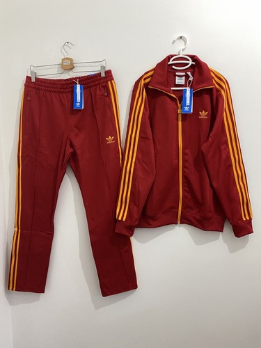 red and yellow adidas tracksuit