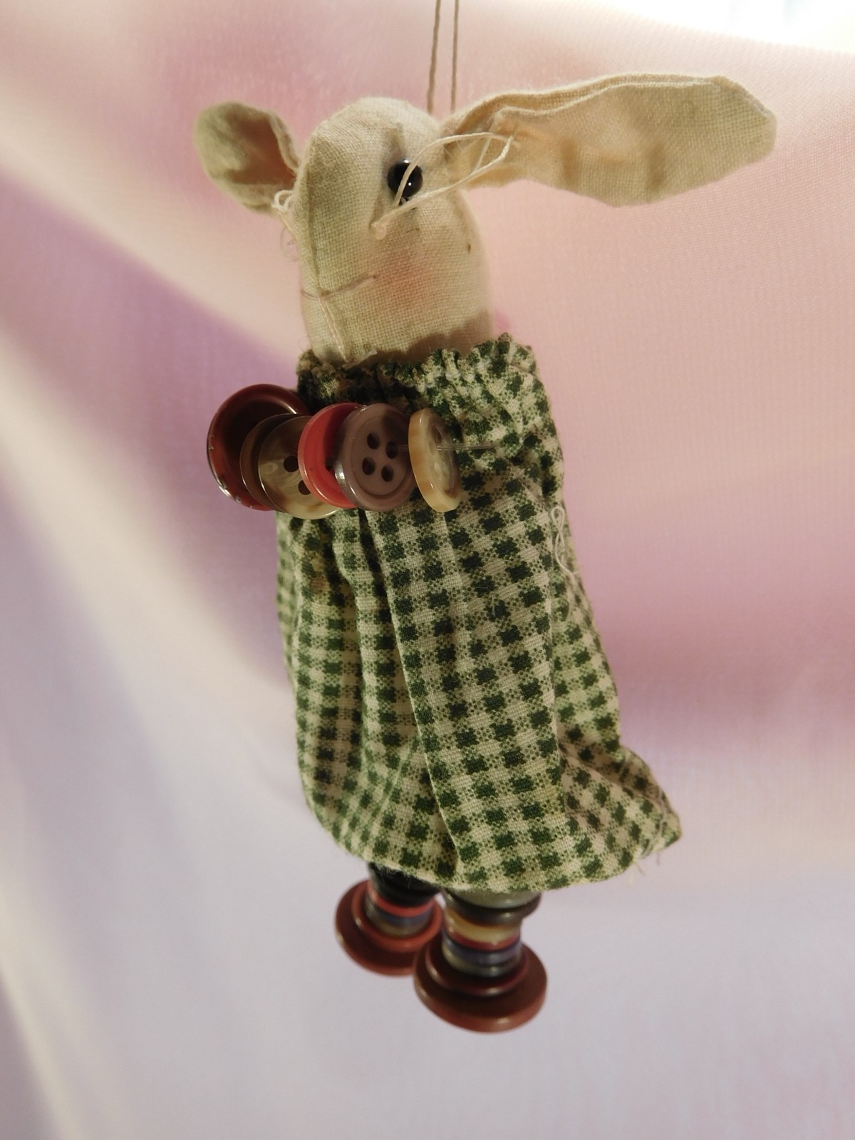 Pair of button bunnies in gingham dresses