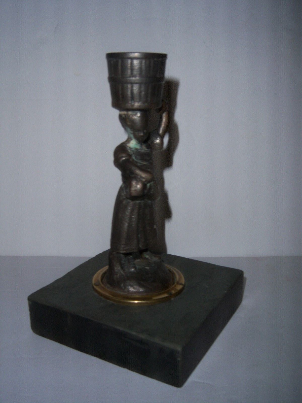 ..ANTIQUE CAST IRON WOMAN CANDLE HOLD ON MARBLE