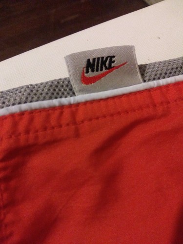 Nike swim trunks board shorts. Orange. Size small mesh lined