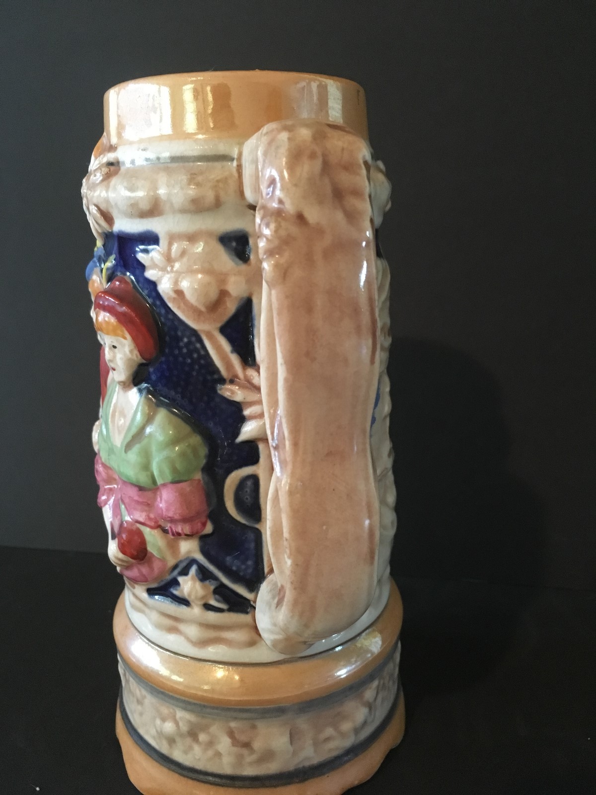 vintage stein hand painted rised man and lady on base