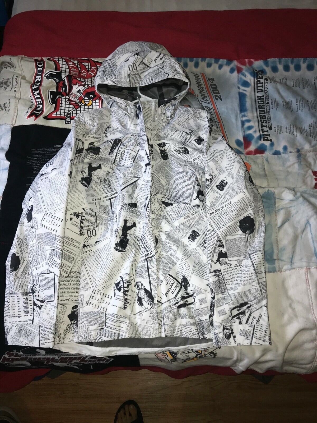 The North Face Newspaper Print Rain Jacket Size M (Black and The North Face Newspaper Print Rain Jacket Size M (Black and