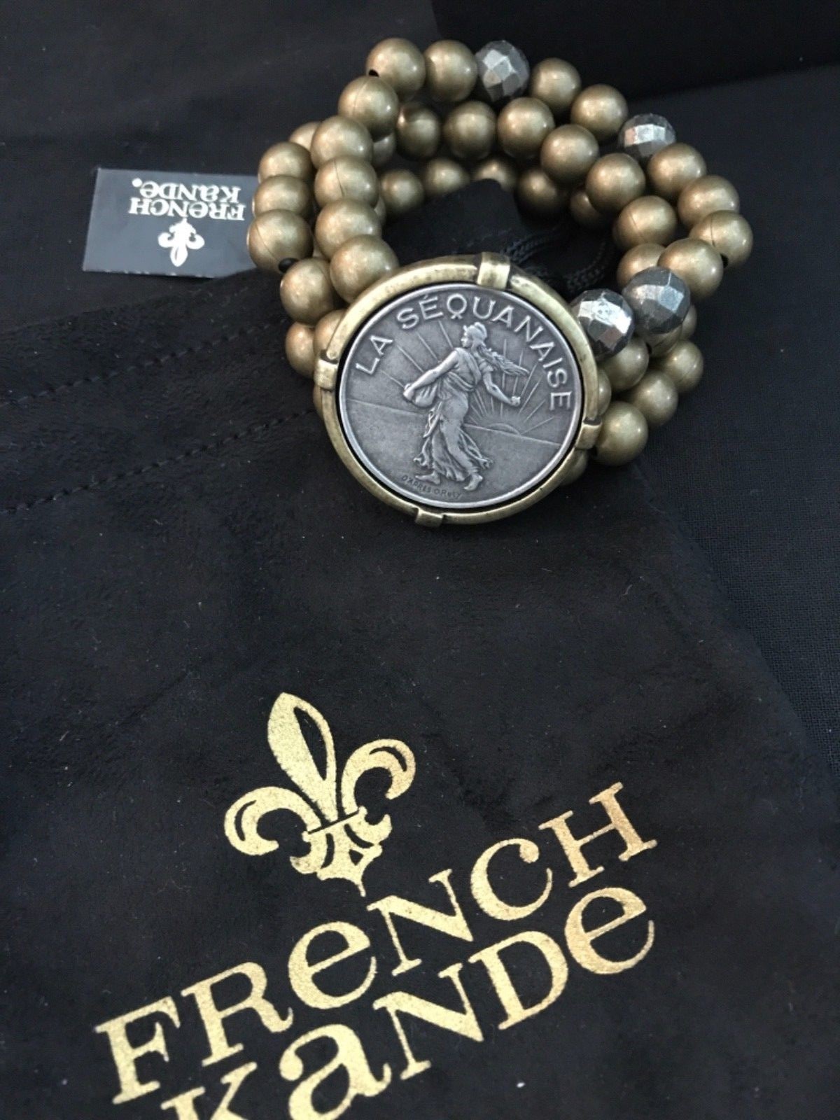 $256 NWT French Kande Triple strand brass/pyrite Bracelet with Liberty Medallion