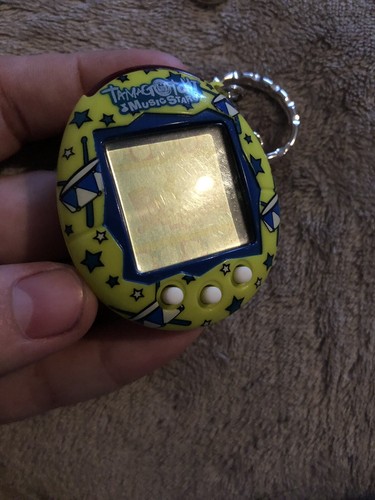 Tamagotchi Lot Of 3 With Lanyards And Charms