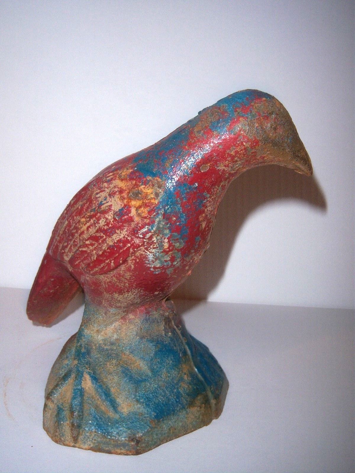 ...ANTIQUE CAST IRON BIRD DOORSTOP