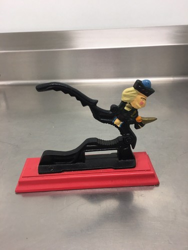 CAST IRON NUTCRACKER, SOLDIER ON RED WOOD BASE