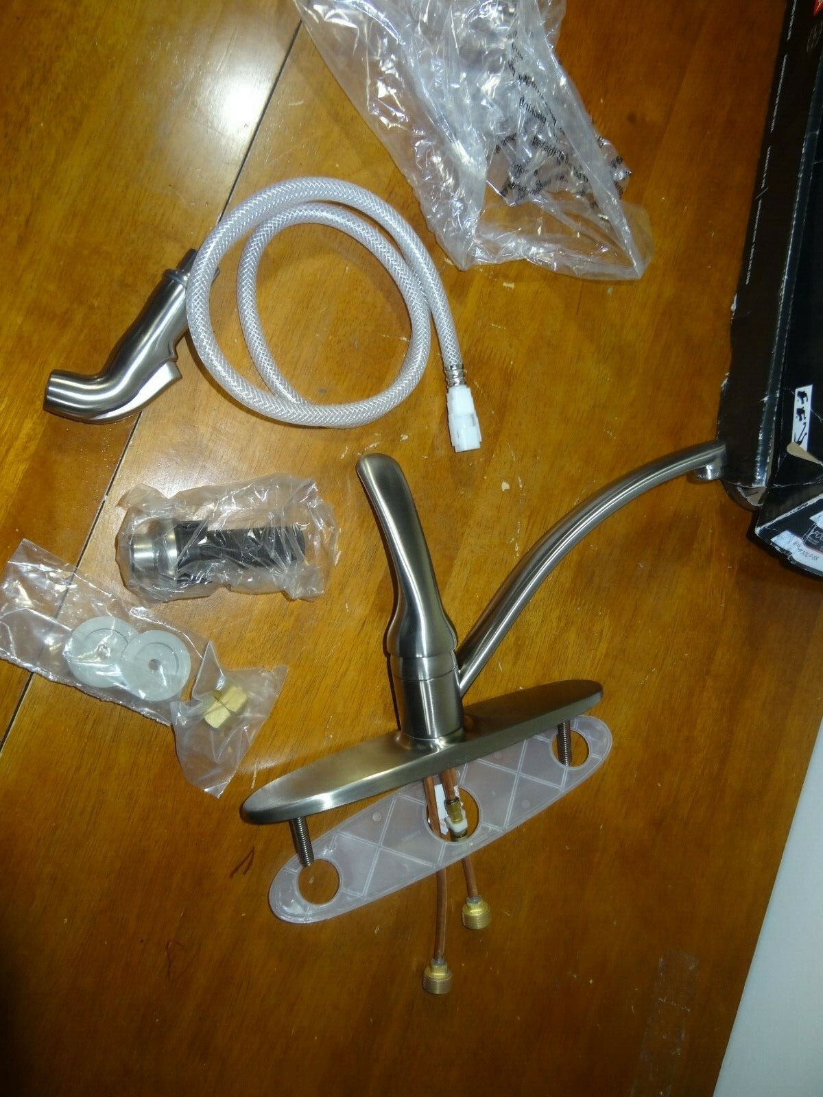 Delta Foundations B4410LFSS Single Handle Kitchen Faucet with hand