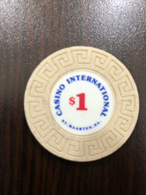 ST MAARTEN CASINO INTERNATIONAL - ONE $1 CASINO CHIP, AS PICTURED.