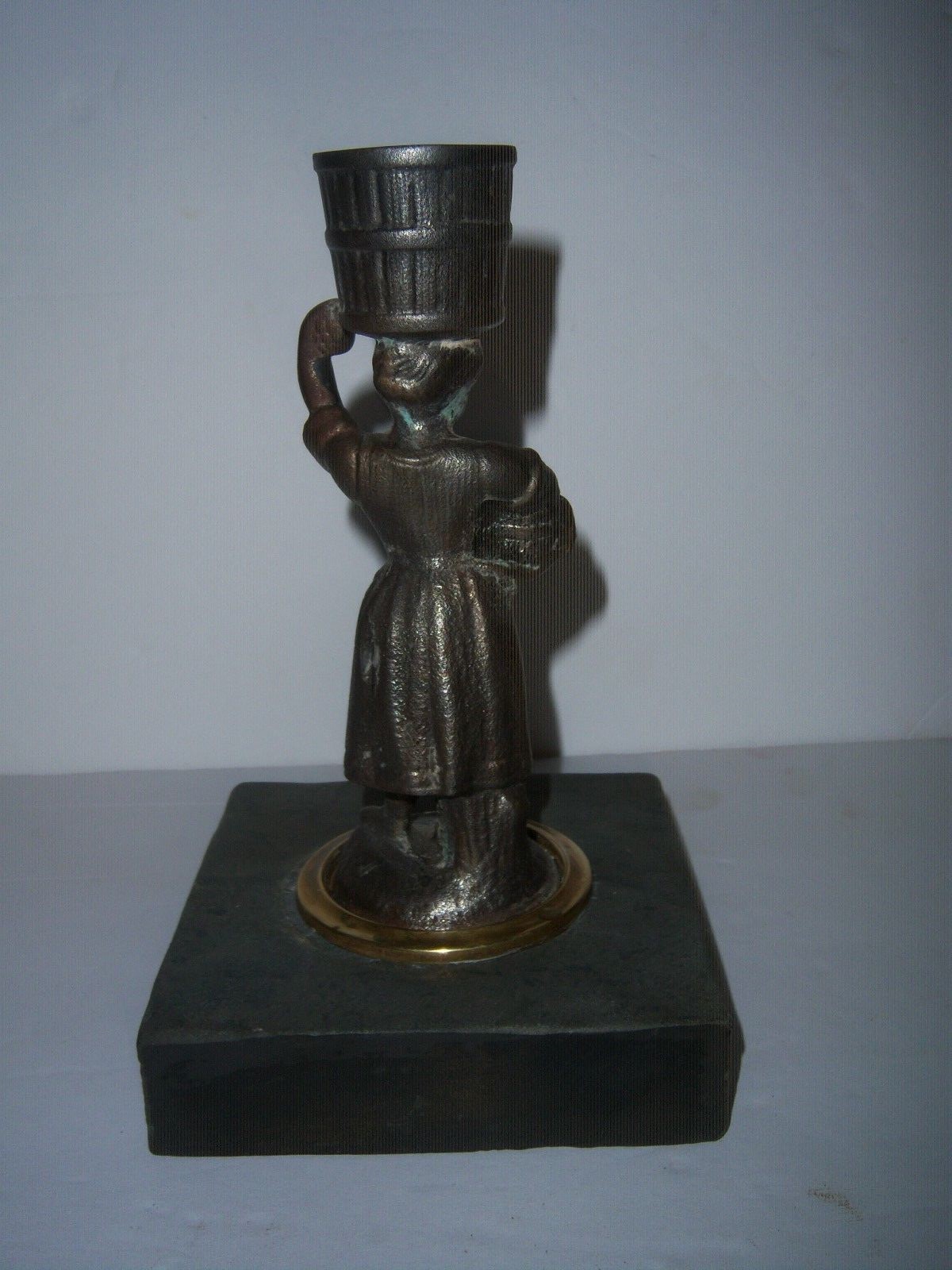 ..ANTIQUE CAST IRON WOMAN CANDLE HOLD ON MARBLE