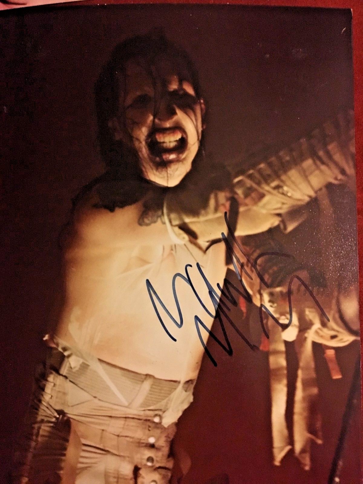 Marilyn Manson autographed the golden age of grotesque whole band with John 5