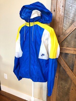yellow white and blue nike windbreaker