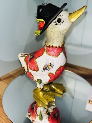 Cute red and gold duck ‘poppy’ wearing her Sunday best hat.  