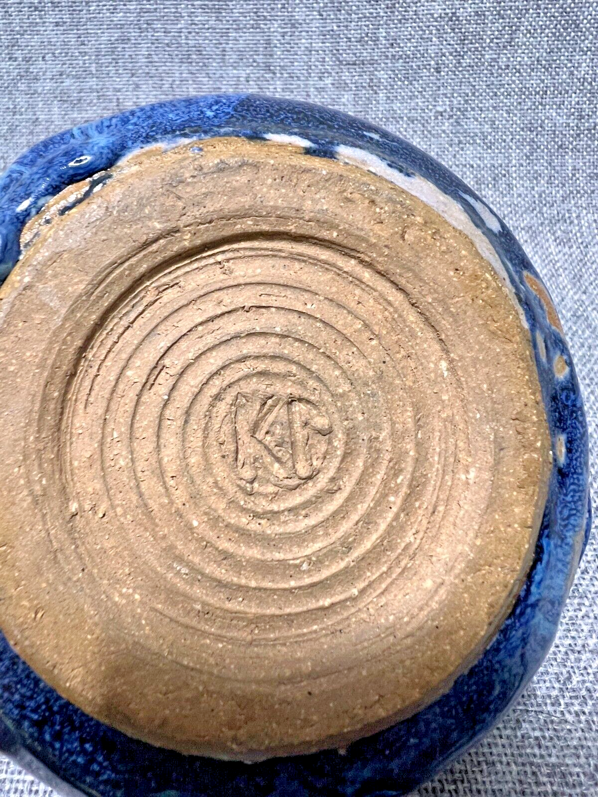 Shallow Round Pottery Bowl - Grey with Blue glaze - Signed KP