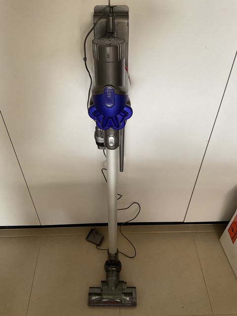 Dyson DC35 stick vacuum with wall 
