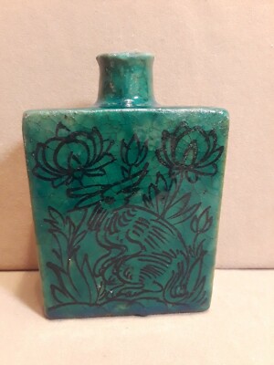 green ceramic plate whit persian writing for love