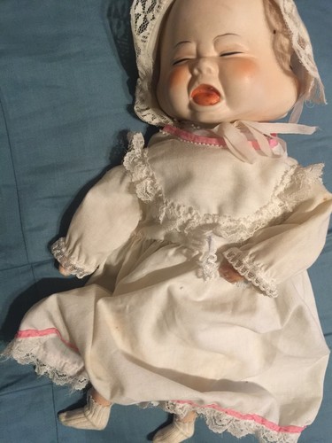 antique porcelain doll with 3 faces