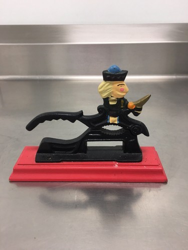 CAST IRON NUTCRACKER, SOLDIER ON RED WOOD BASE