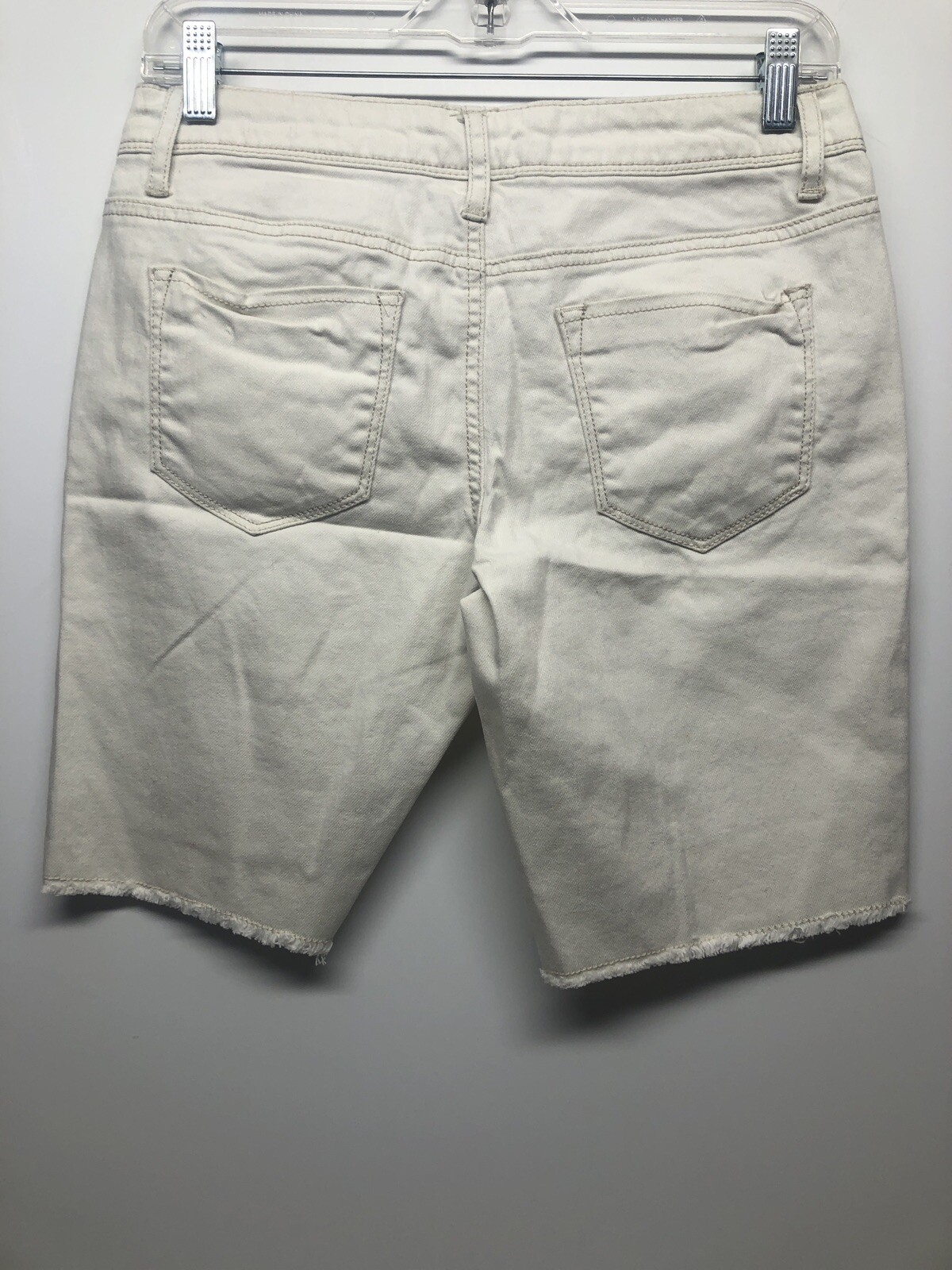 white torn shorts