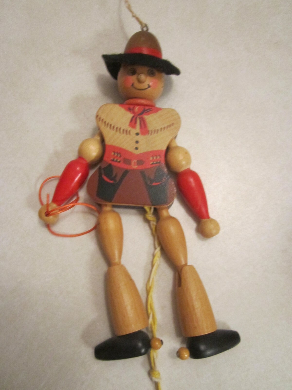 vintage wooden cowboy jumping-jack (marionette) puppet