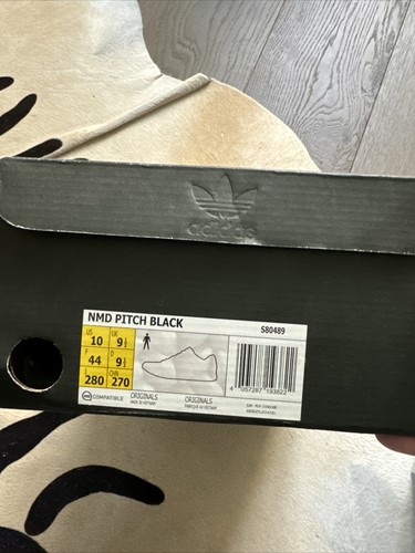 nmd r1 friends and family pitch black