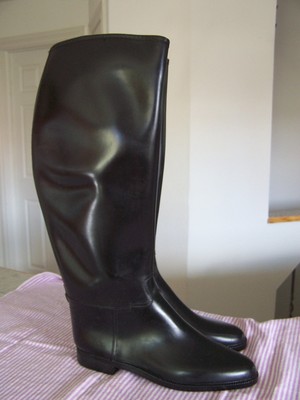 women in rubber riding boots