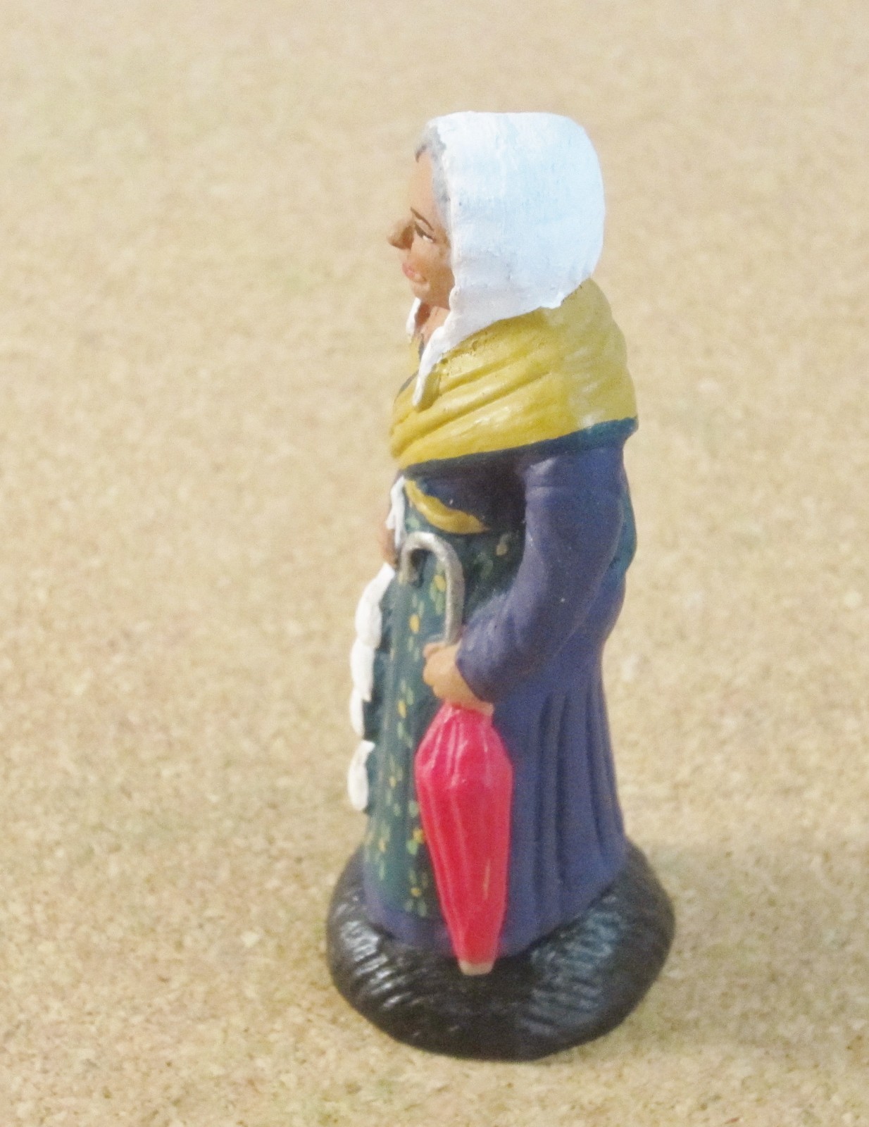 Castelin-Peirano French Nativity santon #2 or #3 woman with garlic and umbrella