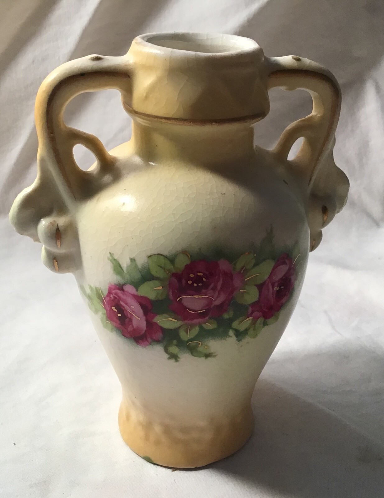 Antique vase with yellow flowers with Crown on bottom