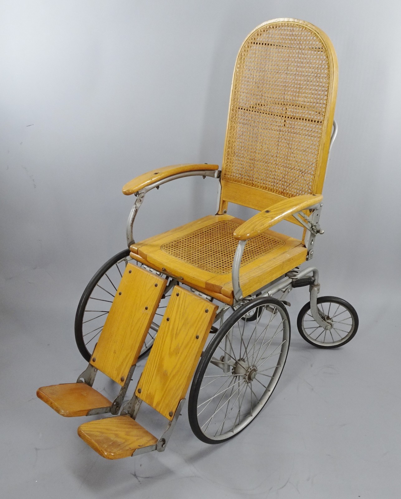 Vintage Wooden and Steel Antique Wheelchair with Cane Seat, Fully Adjustable