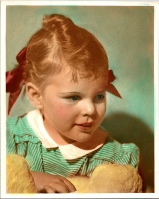 Color added to photo of little girl, red bows & green top B+W Found Photo VB082
