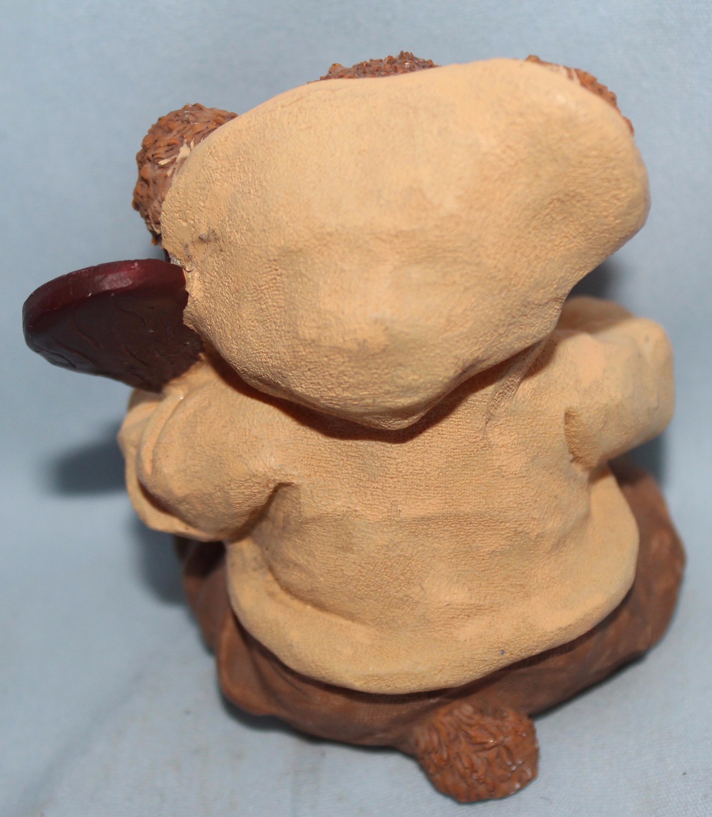 Bear figurine with fish and paddle. Hoodie w/ letter A