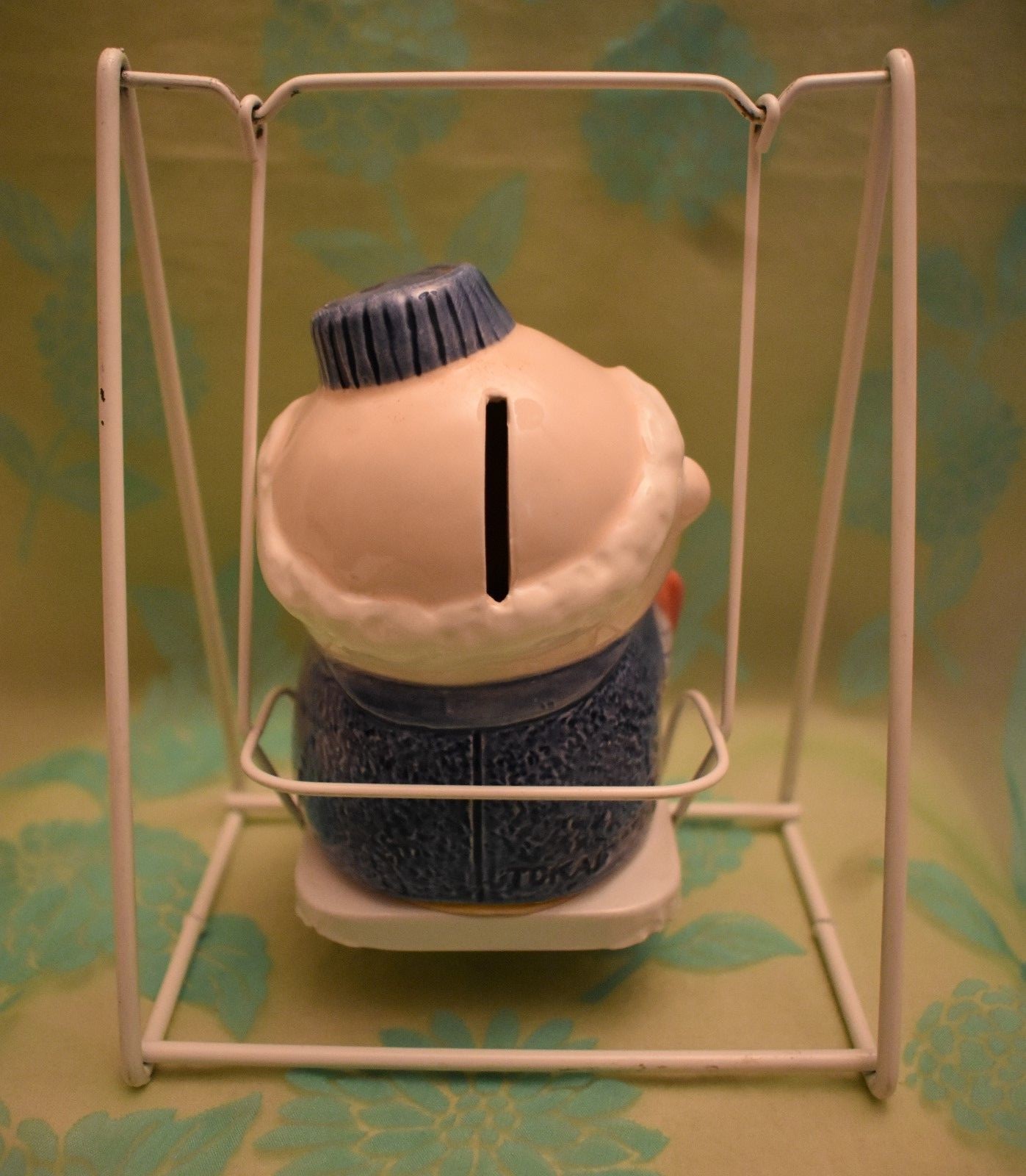 Grandpa and Baby Ceramic Bank on Metal Swing Has stopper 6 3/8 inches tall