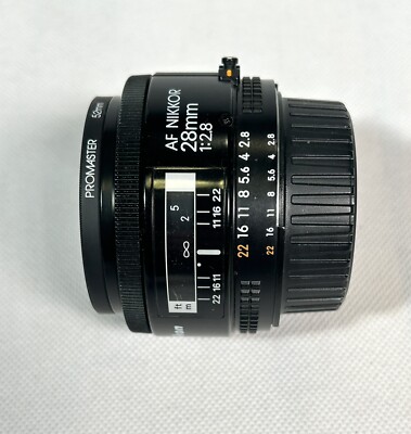 NEAR MINT - Nikon AF NIKKOR 28mm f/2.8 lens from Japan w/Promaster UV filter