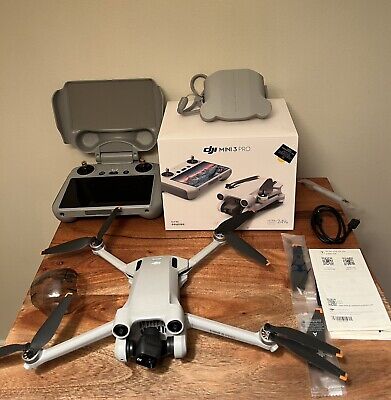 dji mini 3 pro drone W/ Extras. Broken gimbal, flies, takes photos, but *READ