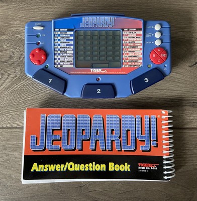 Tiger Electronics 1995 JEOPARDY! Electronic Handheld Game - 1 Cartridge & Book