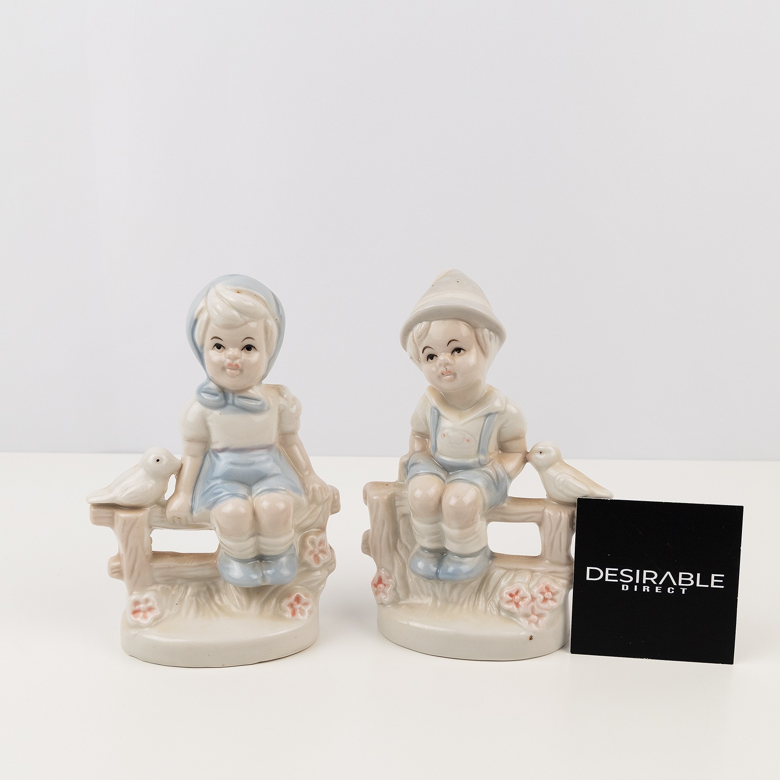 Ceramic Boy & Girl Figurine Set On Fence With Birds Ornament