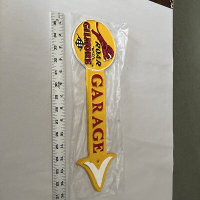 CAST IRON ROAR WITH GILMORE GARAGE ARROW SIGN