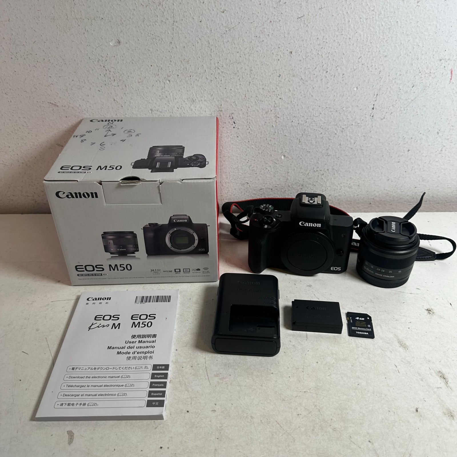 Canon EOS M50 Black Handheld Mirrorless Camera with EF-M 15