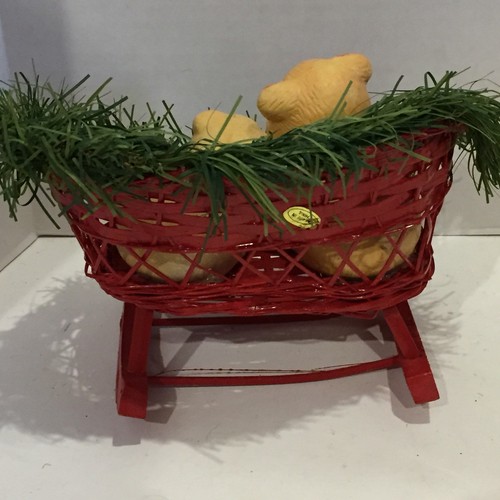 Two Ceramic Pigs in a Wooden Christmas Sled Decor